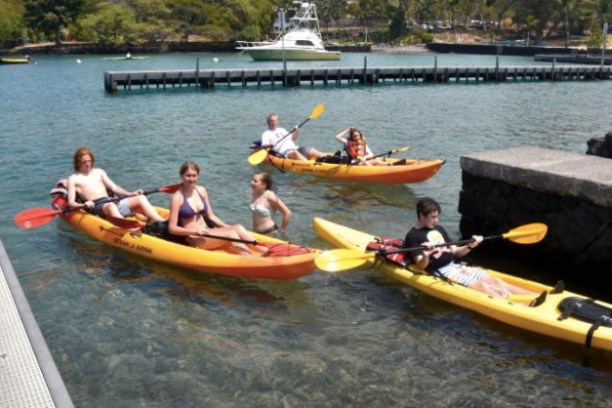 a group of people on a boat in the water